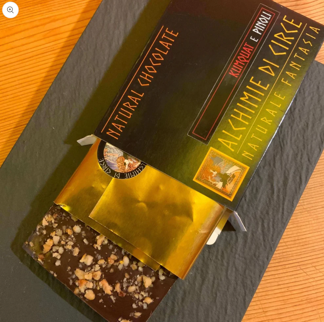 Chocolate negro 70% kumquat y piñones 100g
